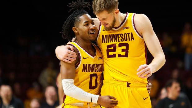 Elijah Hawkins and Parker Fox embrace